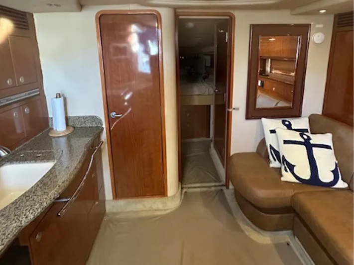  Yacht Photos Pics Interior of 2005 Sea Ray 390 Sundancer yacht with modern kitchen and seating area.