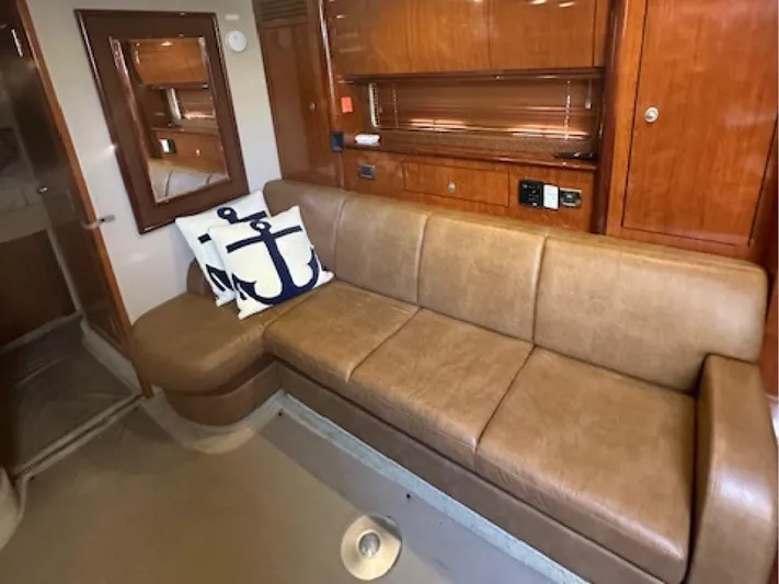  Yacht Photos Pics Luxurious interior of 2005 Sea Ray 390 Sundancer with leather sofa and nautical decor.