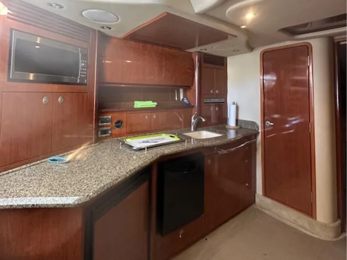  Yacht Photos Pics Interior of 2005 Sea Ray 390 Sundancer yacht with modern kitchen amenities.