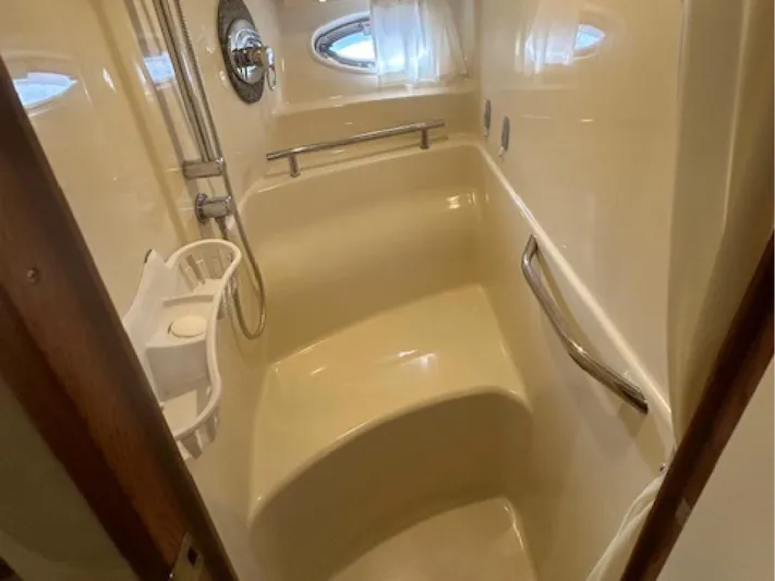  Yacht Photos Pics Shower area in 2005 Sea Ray 390 Sundancer yacht, featuring sleek design and modern fixtures.