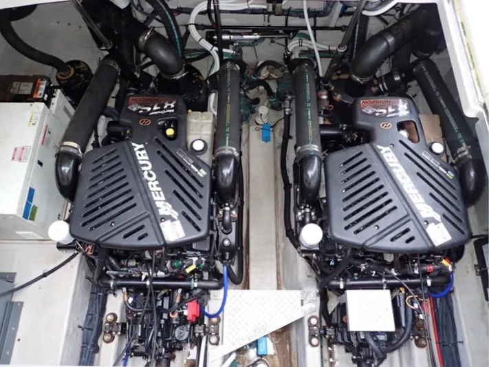  Yacht Photos Pics Twin Mercury engines in a 2005 Sea Ray 390 Sundancer boat.