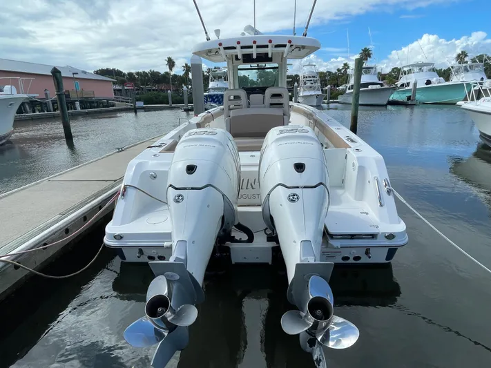 Yacht Photos Pics 2018 Boston Whaler 330 Outrage boat with dual engines docked at marina.