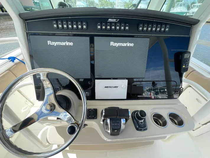  Yacht Photos Pics 2018 Boston Whaler 330 Outrage helm with Raymarine displays and Mercury controls.