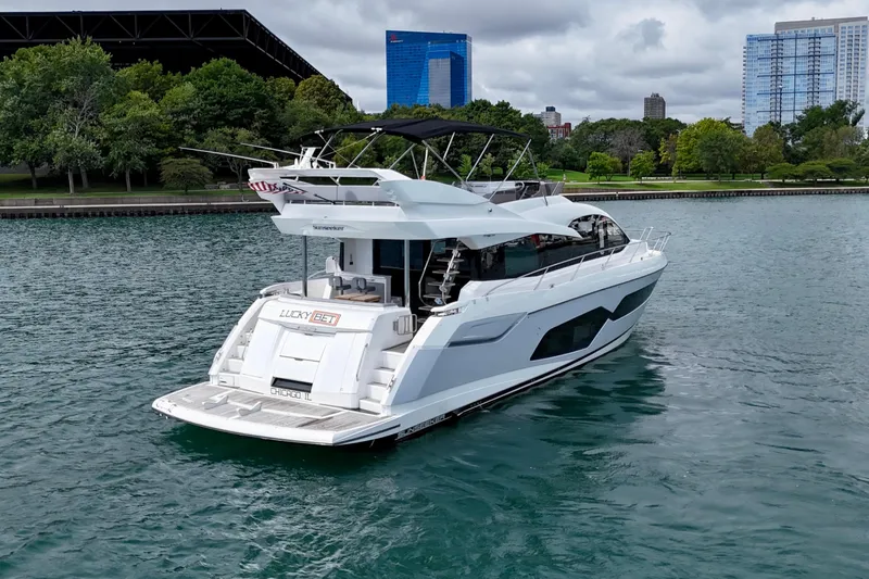  Yacht Photos Pics 2019 Sunseeker Manhattan 66 yacht on water, cityscape background.