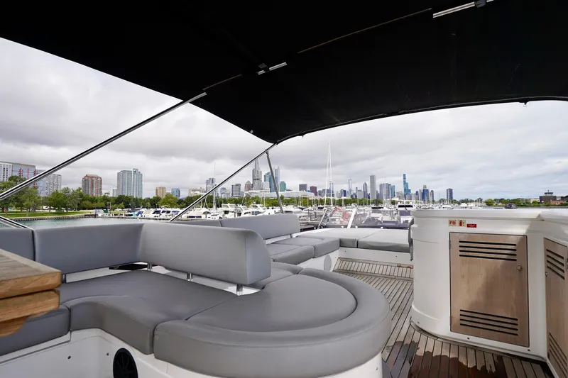  Yacht Photos Pics Luxurious 2019 Sunseeker Manhattan 66 yacht with city skyline view, featuring spacious seating.