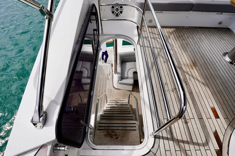  Yacht Photos Pics Staircase on 2019 Sunseeker Manhattan 66 yacht with teak deck and ocean view.
