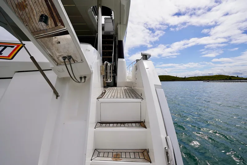  Yacht Photos Pics Staircase on 2019 Sunseeker Manhattan 66 yacht with ocean view.