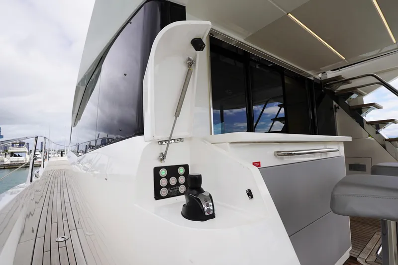  Yacht Photos Pics 2019 Sunseeker Manhattan 66 yacht deck with control panel and seating area.