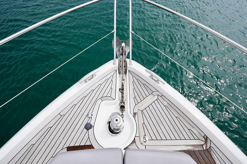  Yacht Photos Pics Bow of 2019 Sunseeker Manhattan 66 yacht on turquoise water.