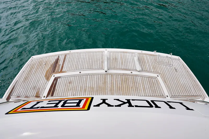  Yacht Photos Pics Rear view of 2019 Sunseeker Manhattan 66 yacht with "Lucky Bet" text on deck.