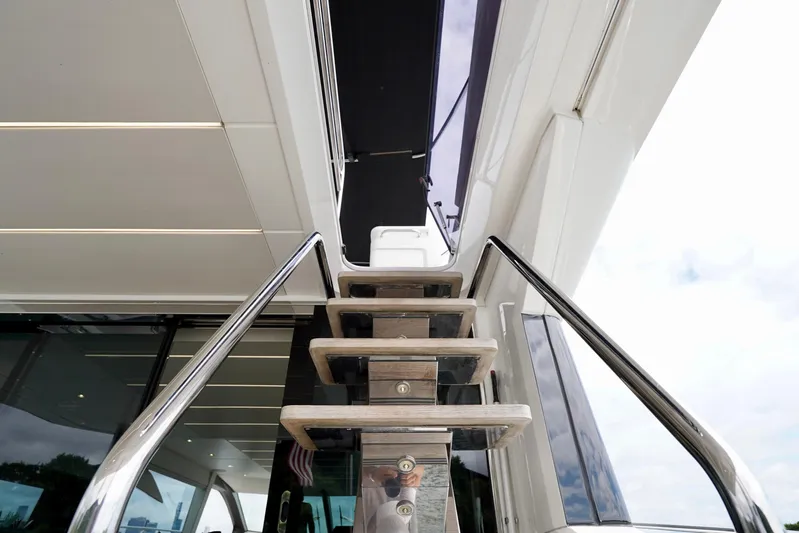  Yacht Photos Pics Staircase on 2019 Sunseeker Manhattan 66 yacht, featuring sleek design and modern architecture.