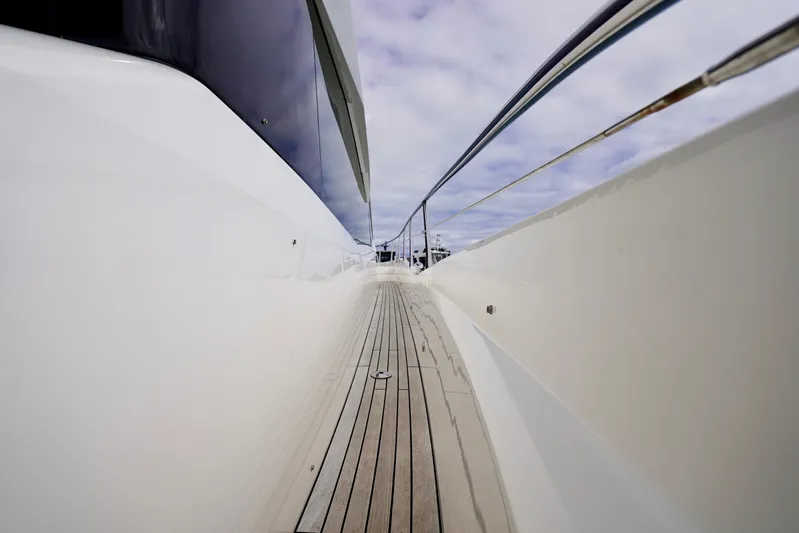  Yacht Photos Pics 2019 Sunseeker Manhattan 66 yacht deck with sleek design and polished railings.