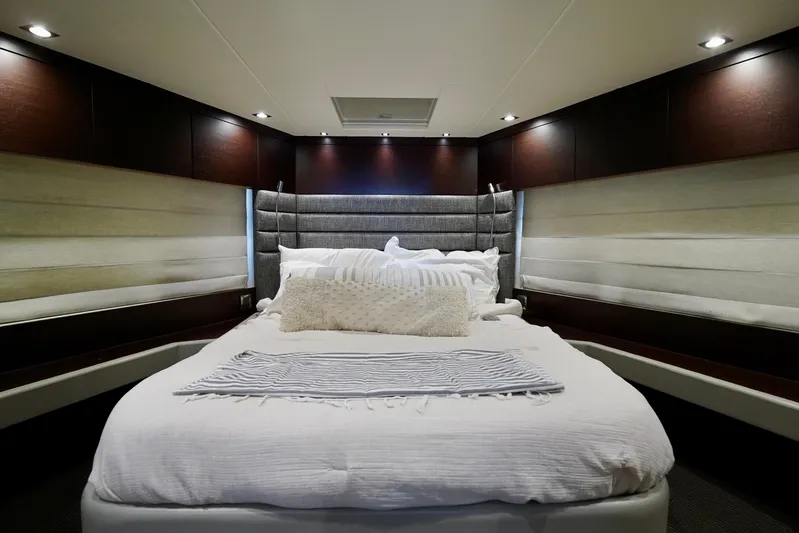  Yacht Photos Pics Luxurious bedroom interior of 2019 Sunseeker Manhattan 66 yacht with elegant bedding.
