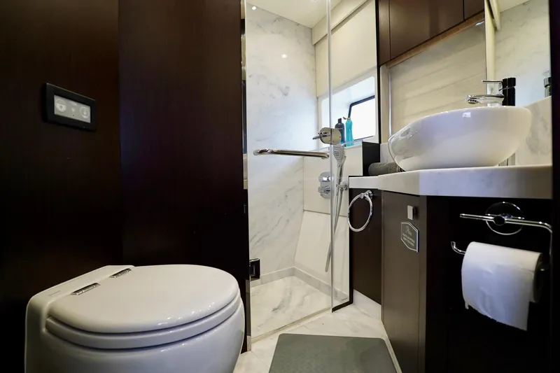  Yacht Photos Pics Luxurious bathroom in 2019 Sunseeker Manhattan 66 yacht with modern fixtures and elegant design.