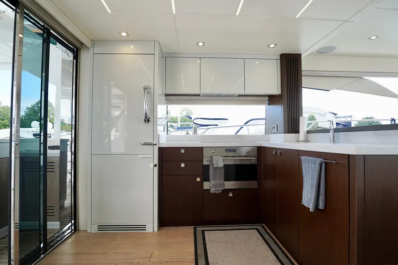  Yacht Photos Pics Luxurious kitchen interior of 2019 Sunseeker Manhattan 66 yacht with modern appliances.