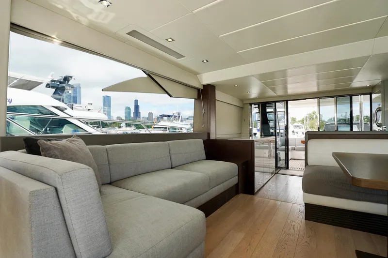  Yacht Photos Pics Luxurious interior of 2019 Sunseeker Manhattan 66 yacht with city skyline view.