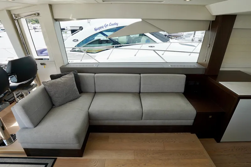  Yacht Photos Pics Luxurious interior of 2019 Sunseeker Manhattan 66 yacht with modern gray sofa.