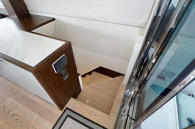  Yacht Photos Pics Staircase in 2019 Sunseeker Manhattan 66 yacht with modern wood and marble design.