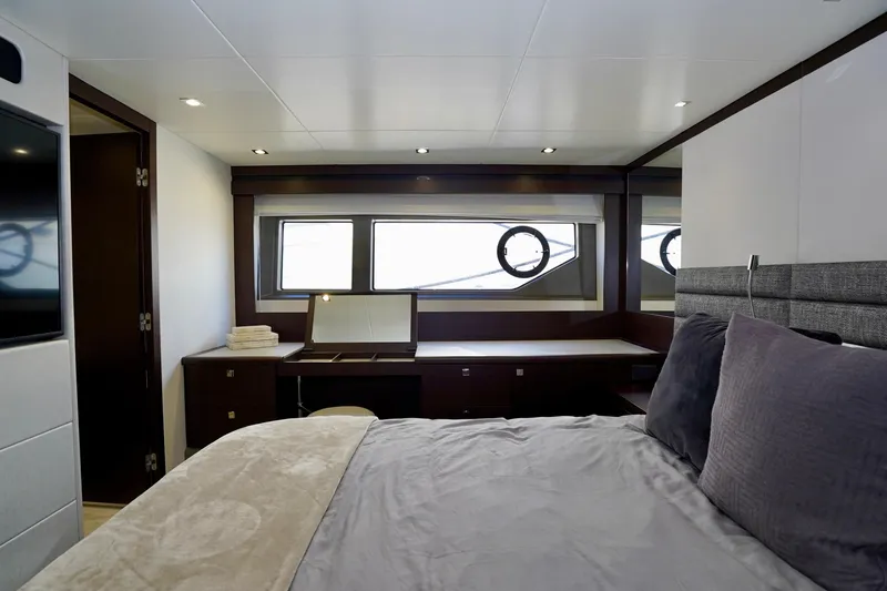  Yacht Photos Pics Luxurious bedroom interior of 2019 Sunseeker Manhattan 66 yacht with modern furnishings.