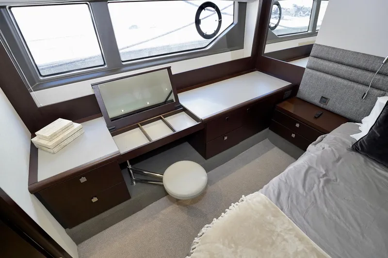  Yacht Photos Pics Luxurious interior of 2019 Sunseeker Manhattan 66 yacht with elegant vanity and seating.