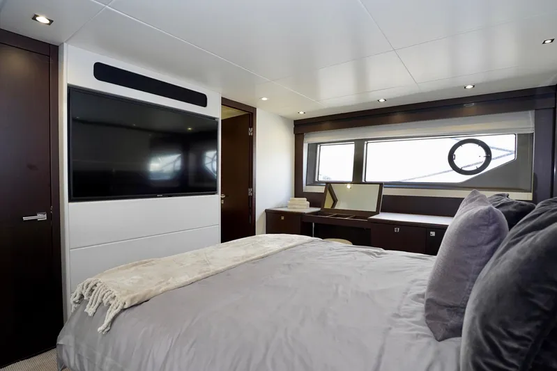  Yacht Photos Pics Luxurious bedroom interior of 2019 Sunseeker Manhattan 66 yacht with modern decor.