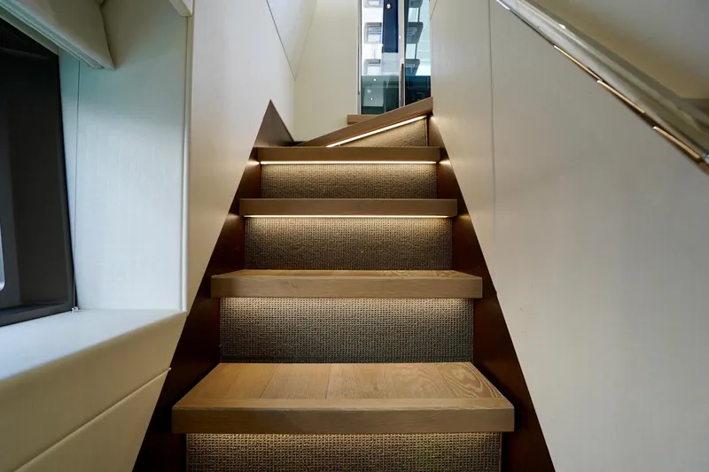  Yacht Photos Pics Staircase with ambient lighting on 2019 Sunseeker Manhattan 66 yacht interior.