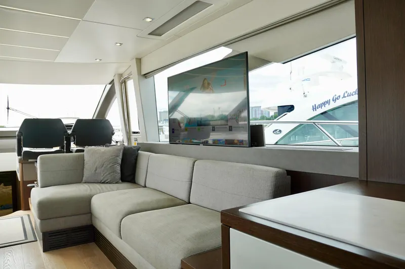  Yacht Photos Pics Luxurious interior of 2019 Sunseeker Manhattan 66 yacht with modern seating and large windows.