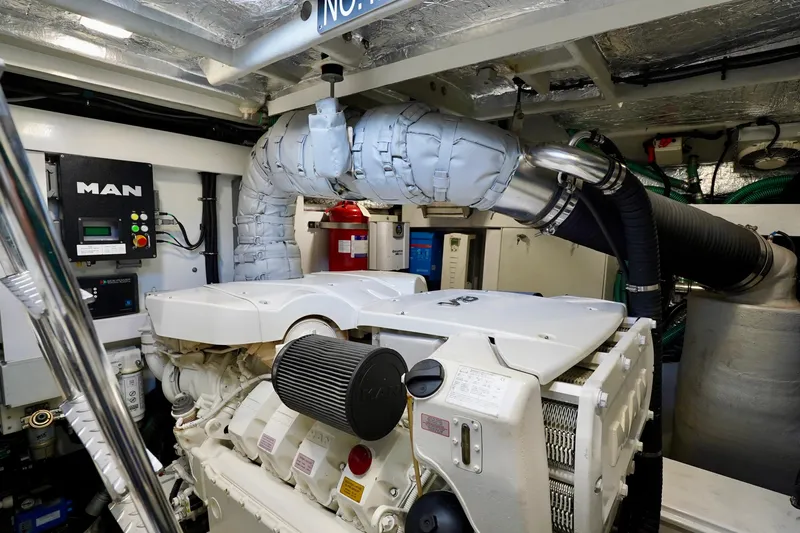  Yacht Photos Pics Engine room of 2019 Sunseeker Manhattan 66 yacht, featuring MAN engine components.