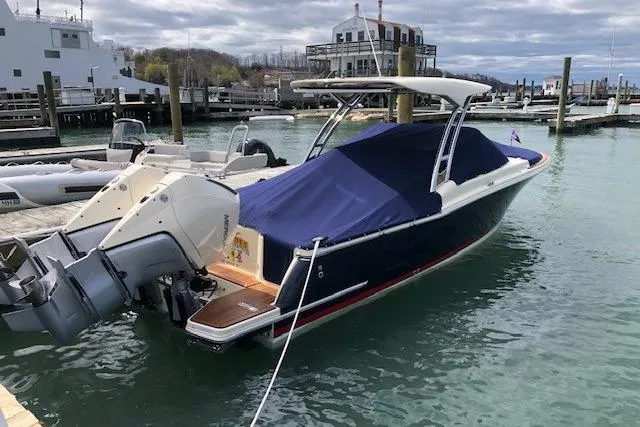  Yacht Photos Pics 2023 Chris-Craft Calypso 28 boat docked with blue cover and twin engines.