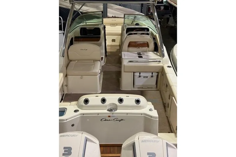 Yacht Photos Pics 2023 Chris-Craft Calypso 28 boat interior with seating and controls.