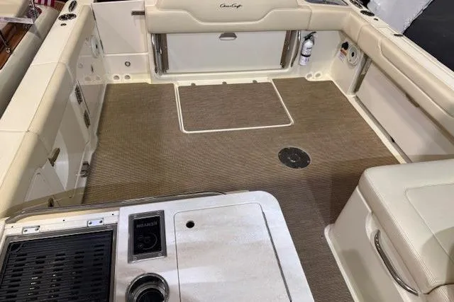  Yacht Photos Pics 2023 Chris-Craft Calypso 28 boat interior with beige seating and deck.