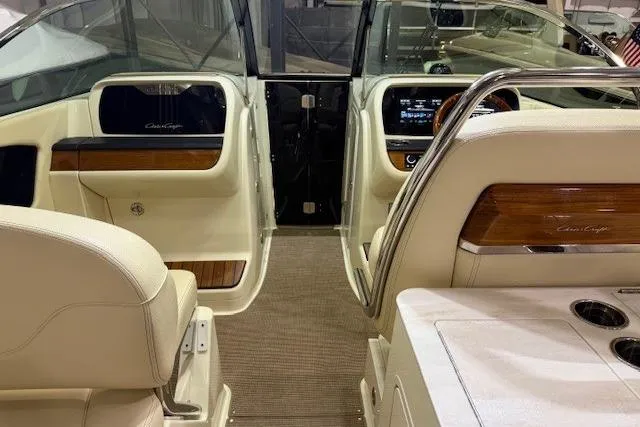  Yacht Photos Pics 2023 Chris-Craft Calypso 28 interior with luxurious seating and modern dashboard design.