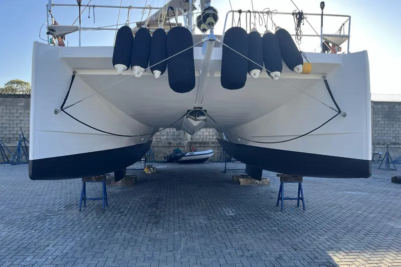 Oz Yacht Photos Pics 2019 Bali 4.1 catamaran on dry dock with protective fenders, viewed from the front.