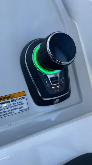  Yacht Photos Pics Evolve 400HT 2022 control panel with illuminated knob and warning label.