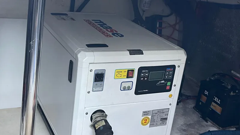  Yacht Photos Pics Evolve 400HT generator, 2022 model, in a utility room setting.