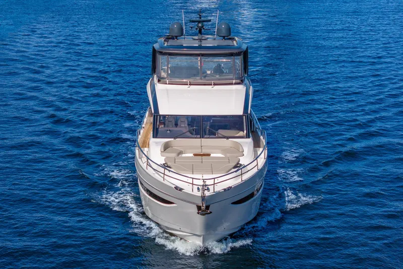 Her Way Yacht Photos Pics Luxurious 2023 Princess Y72 yacht cruising on open blue waters.