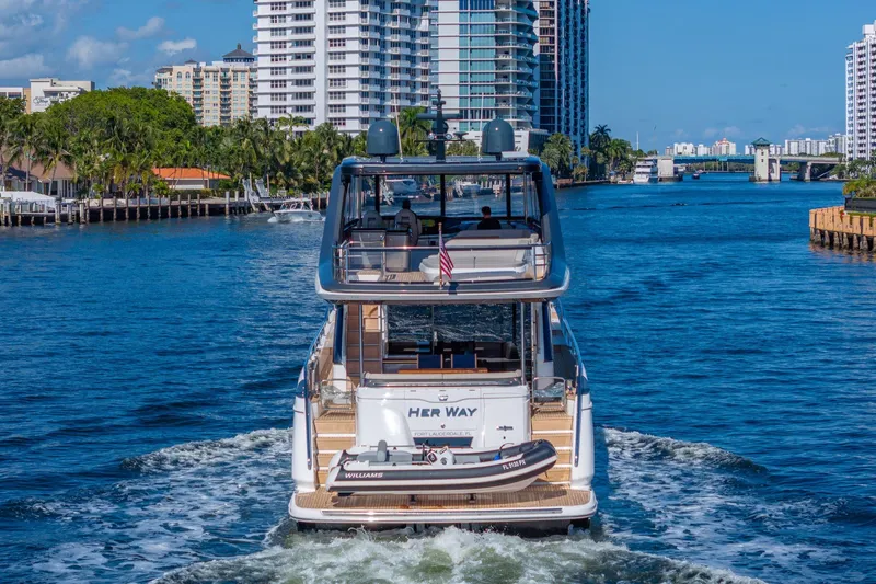 Her Way Yacht Photos Pics Luxury Princess Y72 yacht cruising through a scenic urban waterway, 2023 model.