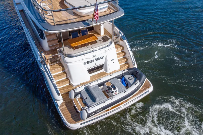 Her Way Yacht Photos Pics Luxury Princess Y72 yacht, 2023 model, with tender boat on water.