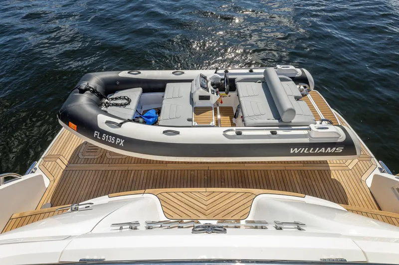Her Way Yacht Photos Pics 2023 Princess Y72 yacht with Williams tender on teak deck, floating on water.
