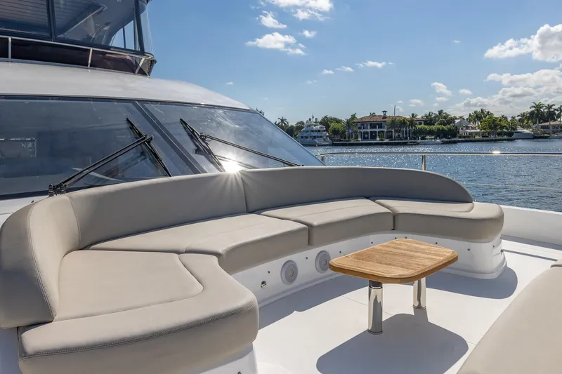 Her Way Yacht Photos Pics Luxurious 2023 Princess Y72 yacht with elegant outdoor seating and scenic waterfront view.