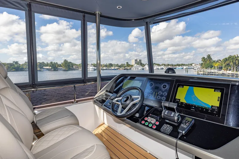 Her Way Yacht Photos Pics Luxurious 2023 Princess Y72 yacht helm with advanced navigation systems and scenic waterfront view.