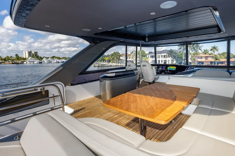 Her Way Yacht Photos Pics Luxurious 2023 Princess Y72 yacht interior with elegant seating and scenic waterfront views.