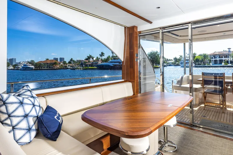 Her Way Yacht Photos Pics Luxurious 2023 Princess Y72 yacht interior with elegant seating and scenic waterfront view.