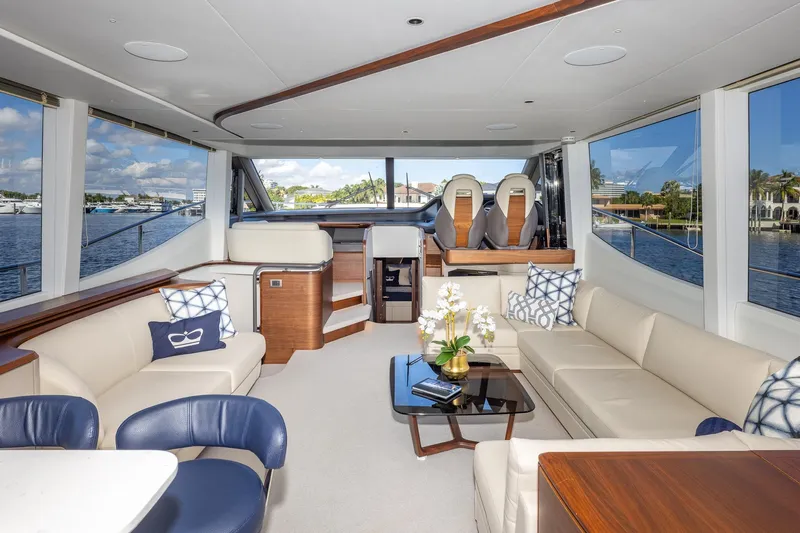Her Way Yacht Photos Pics Luxurious interior of 2023 Princess Y72 yacht with elegant seating and scenic water views.