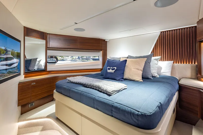 Her Way Yacht Photos Pics Luxurious 2023 Princess Y72 yacht bedroom with elegant decor and comfortable bedding.