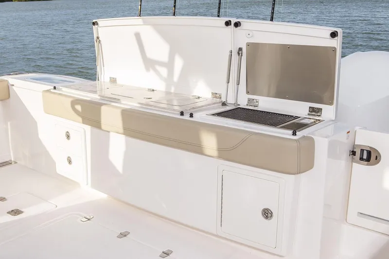  Yacht Photos Pics Manufacturer Provided Image: 2019 Pursuit S 408 Sport boat deck with storage compartments and seating.