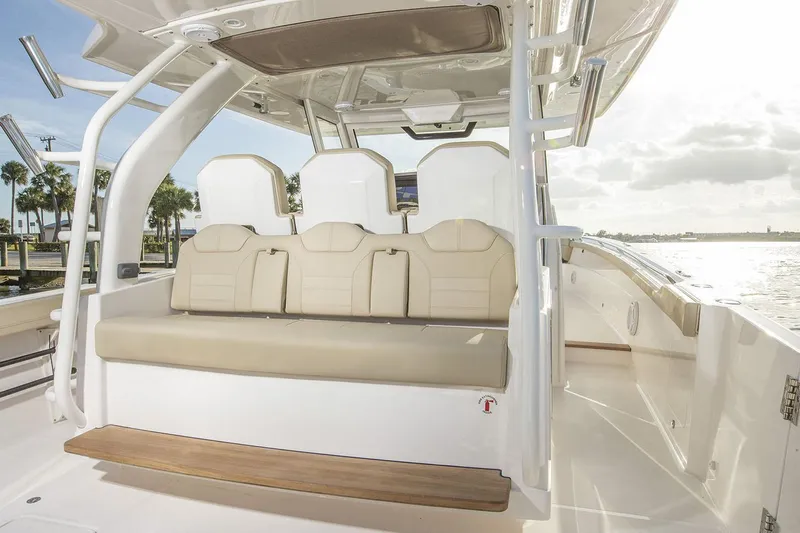  Yacht Photos Pics Manufacturer Provided Image: 2019 Pursuit S 408 Sport boat interior with beige seating and white accents.
