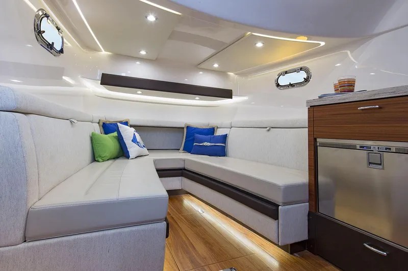 Yacht Photos Pics Manufacturer Provided Image: Interior of 2020 Pursuit S 408 Sport boat with modern seating and wooden flooring.