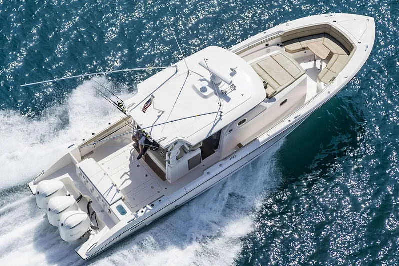  Yacht Photos Pics Manufacturer Provided Image: 2019 Pursuit S 408 Sport boat cruising on open water.