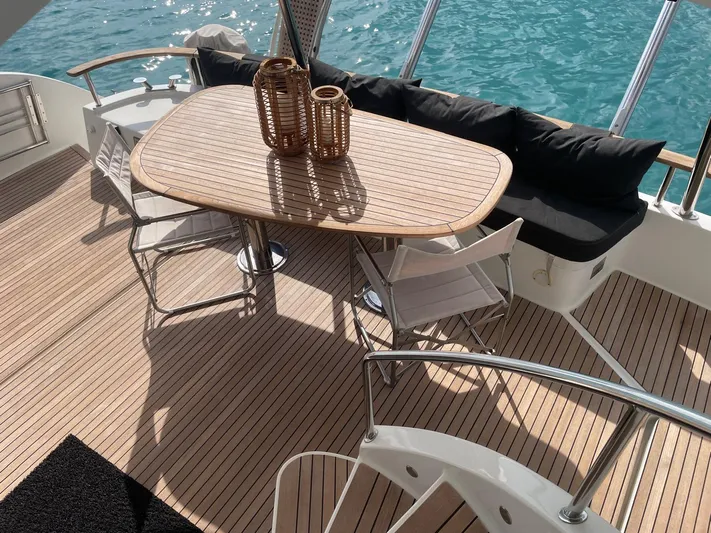 Kishta Yacht Photos Pics Luxurious 2009 Fountaine Pajot Cumberland 46 yacht deck with elegant seating and ocean view.